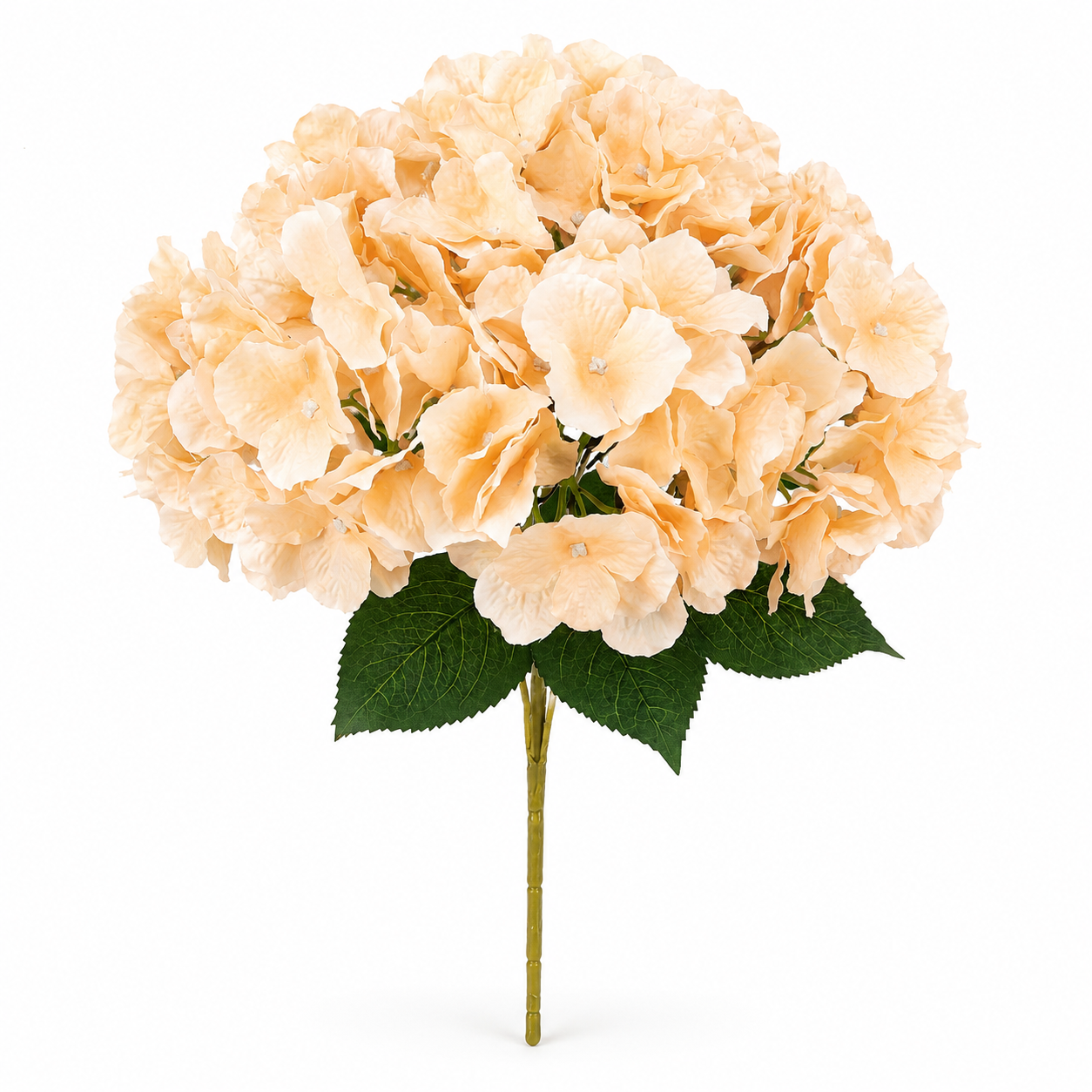 An artificial hydrangea stem with a large round cluster of soft peach-pink blossoms and dark green leaves on a light beige stem, isolated on a white background.